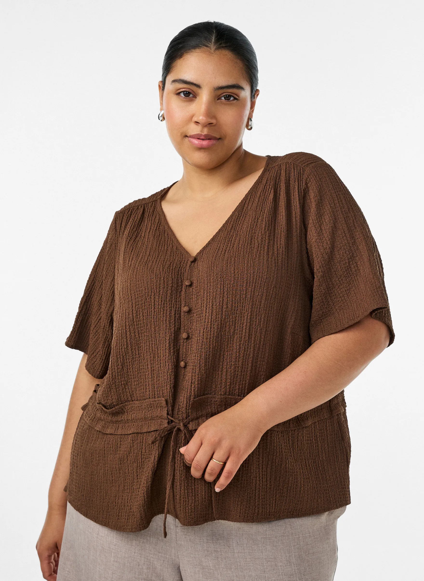 Bluse mit Struktur und Taillenbindung