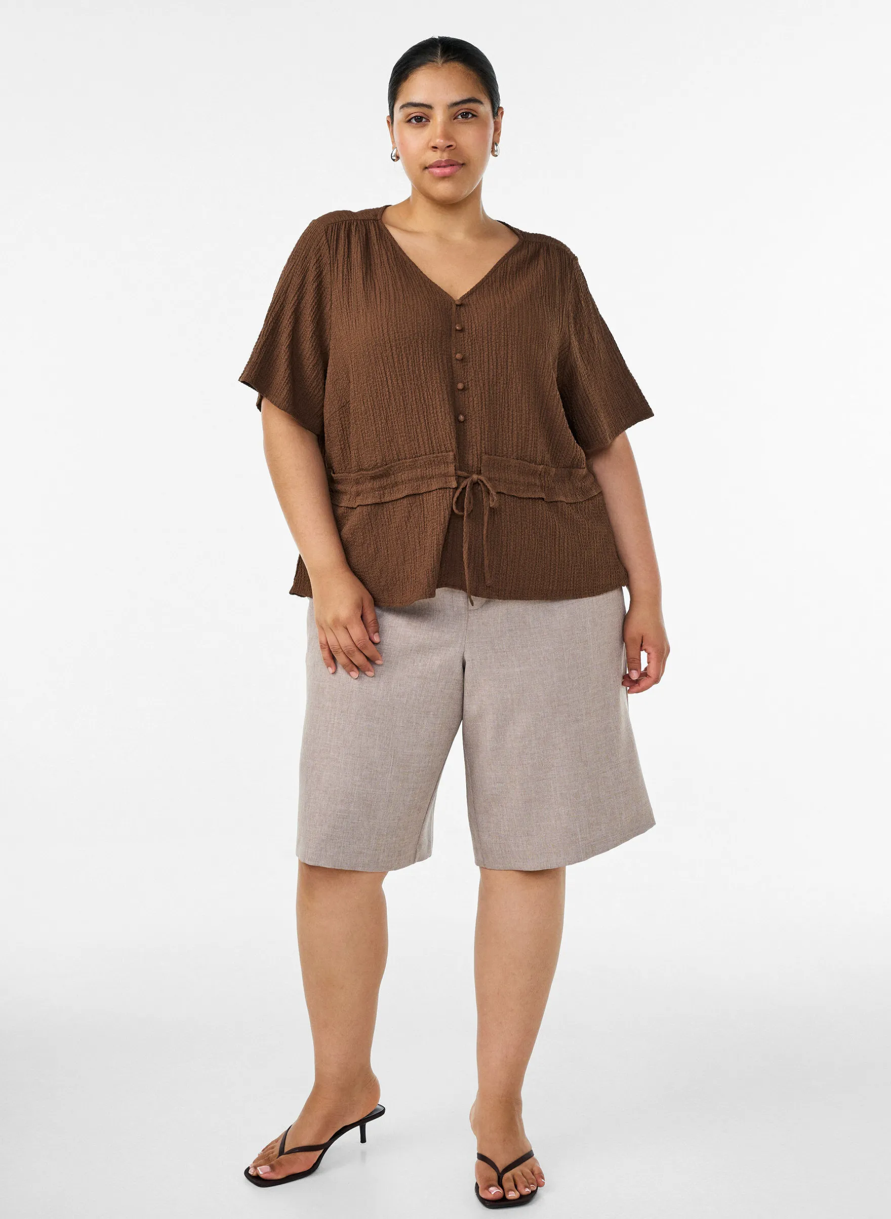 Bluse mit Struktur und Taillenbindung