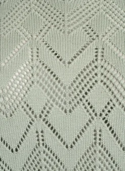 Gemusterte Strickbluse mit welligem Rand und Rundhalsausschnitt