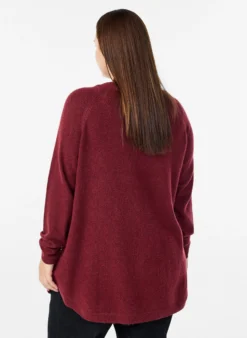 Lange Strickbluse mit Kugelknöpfen