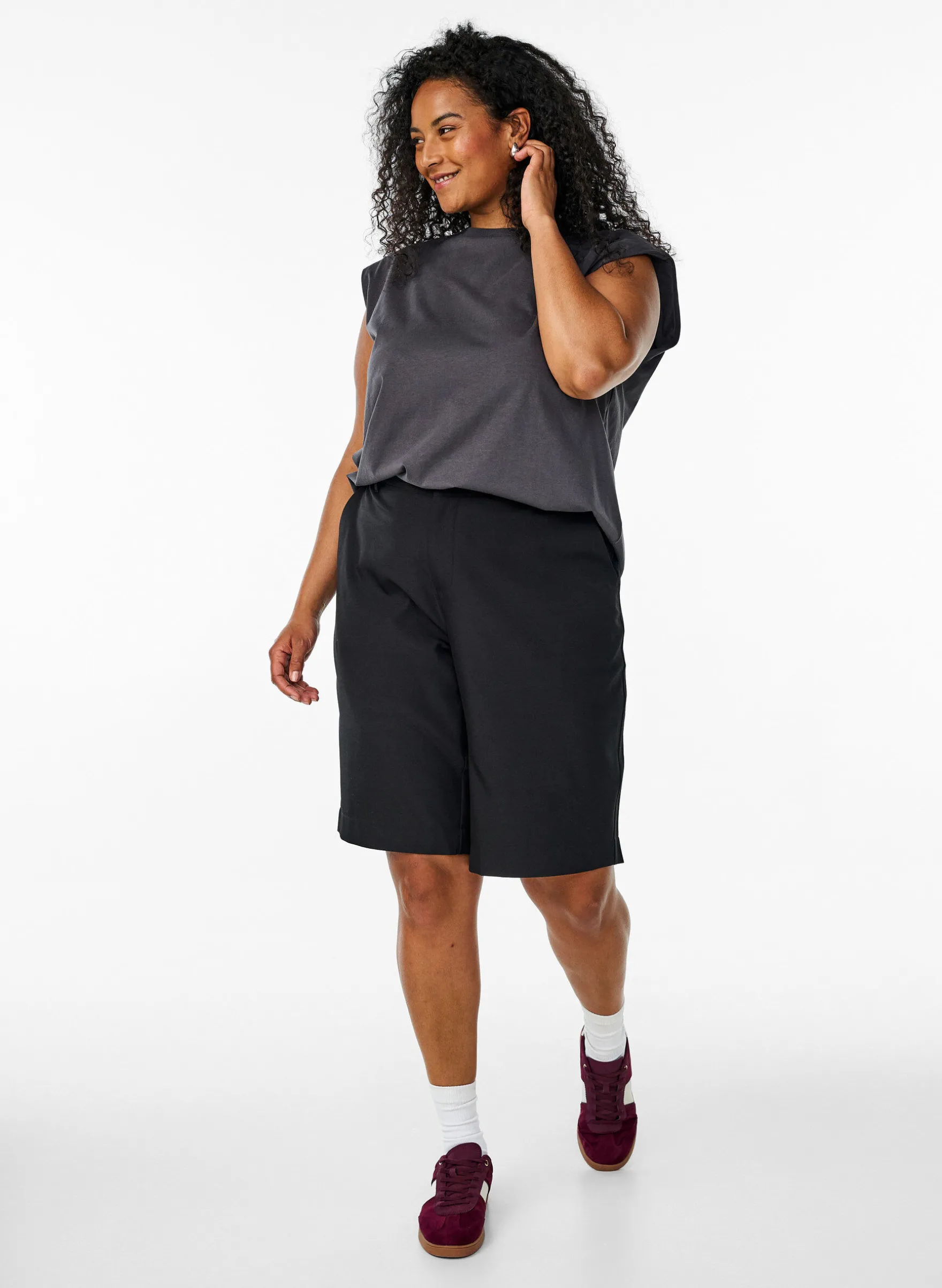 Ärmellose Jerseybluse mit Schulterpolstern.