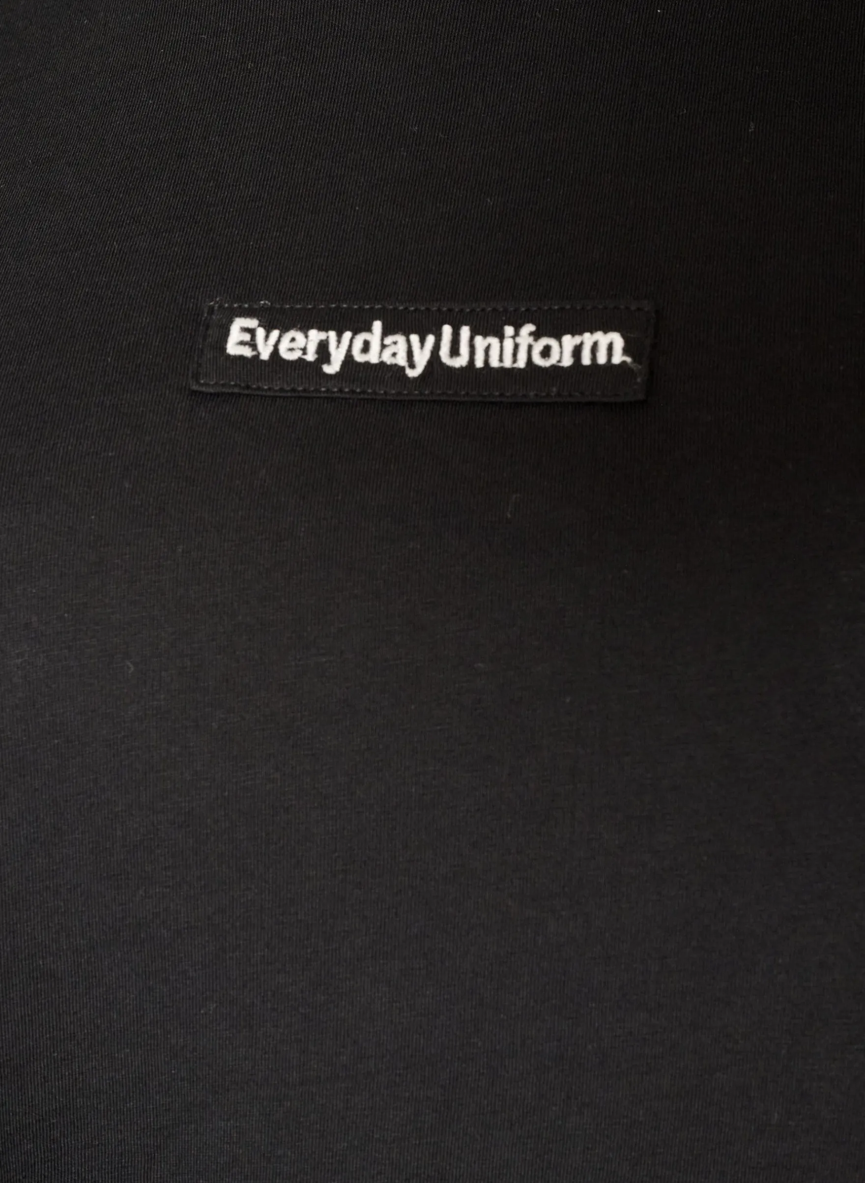 T-Shirt aus Baumwolle mit Text-Badge